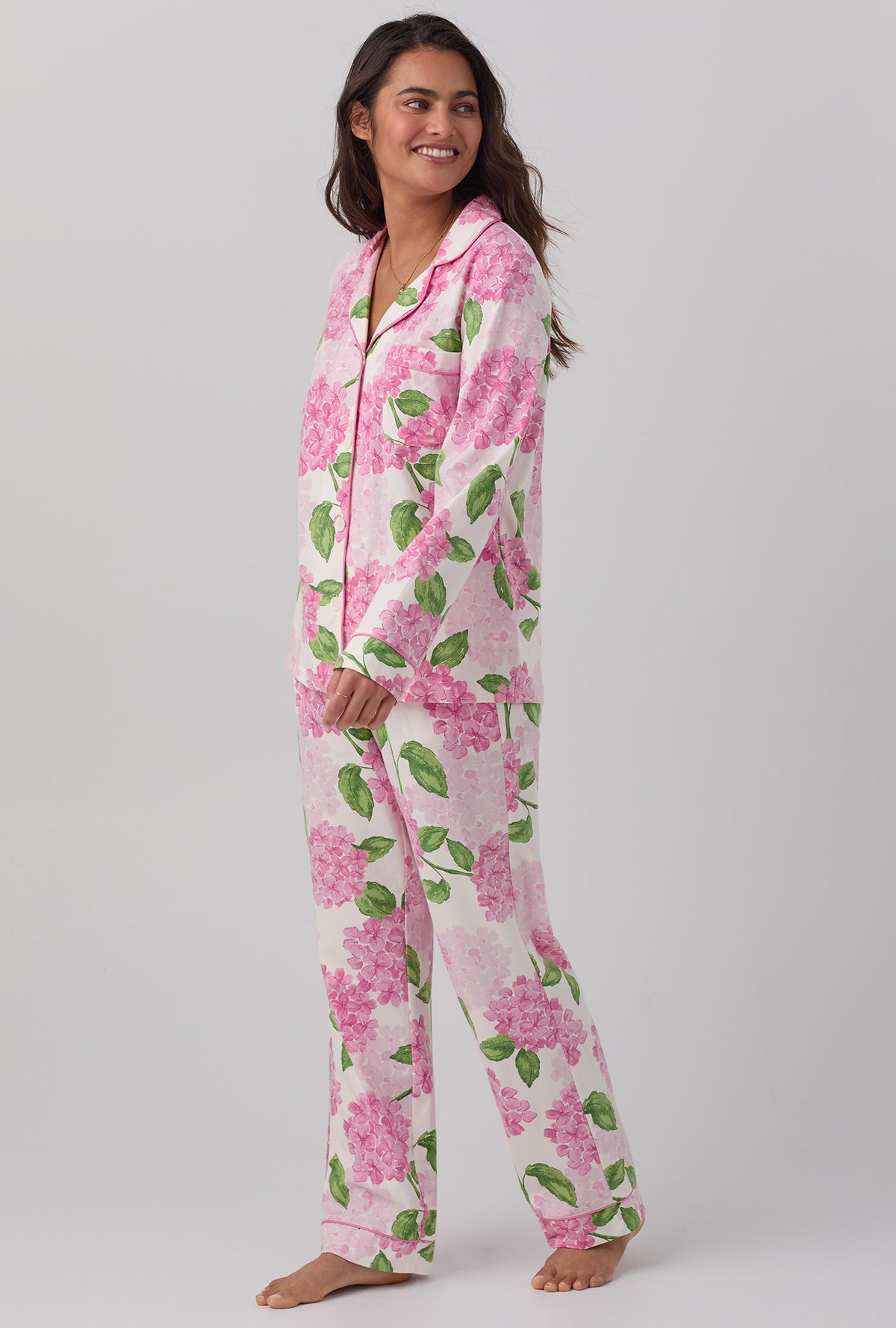 A lady wearing pink Long Sleeve Classic Stretch Jersey PJ Set with Grand Hydrangea print