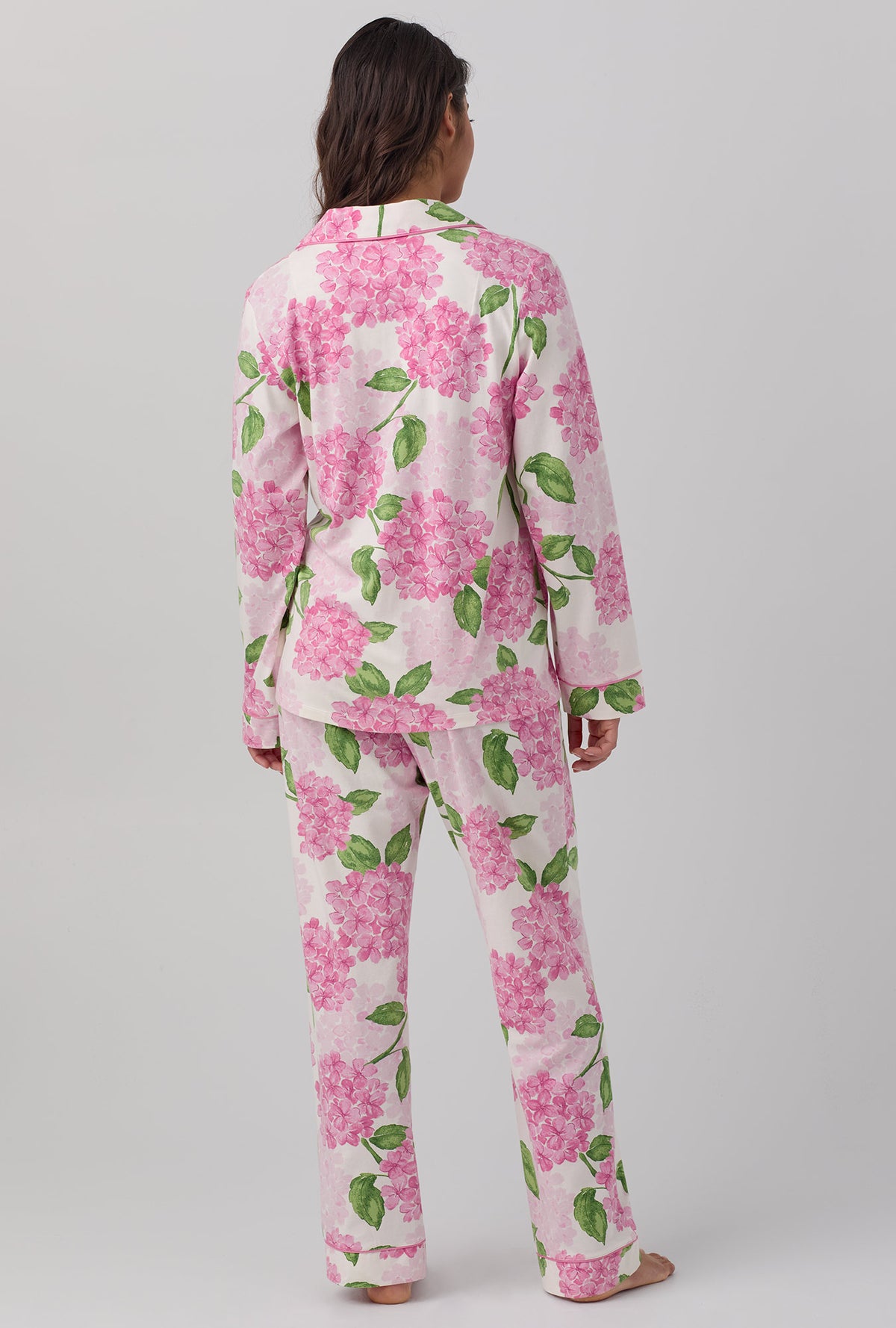 A lady wearing pink Long Sleeve Classic Stretch Jersey PJ Set with Grand Hydrangea print