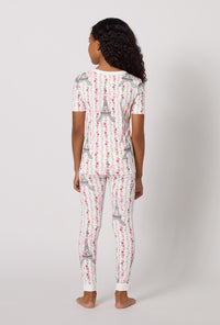 A Girl Wearing Fleur De La Tour Short Sleeve Stretch Jersey Kids Pj Set in a back view pose