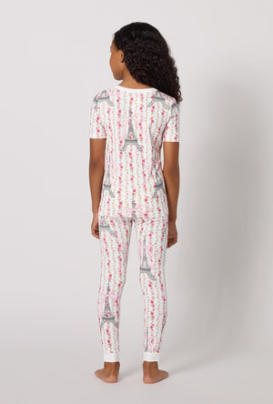 A Girl Wearing Fleur De La Tour Short Sleeve Stretch Jersey Kids Pj Set in a back view pose