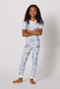 A Girl Wearing Belle Vie Short Sleeve Stretch Jersey Kids Pj Set in a standing pose