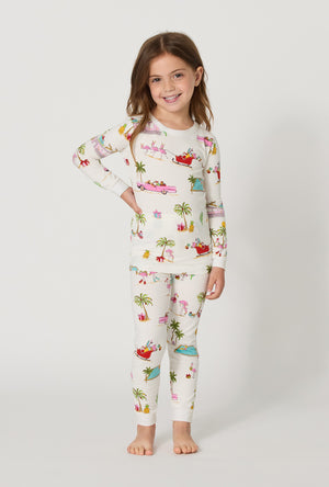 A girl wearing Festive Flamingos Long Sleeve Stretch Jersey Kids Pj Set