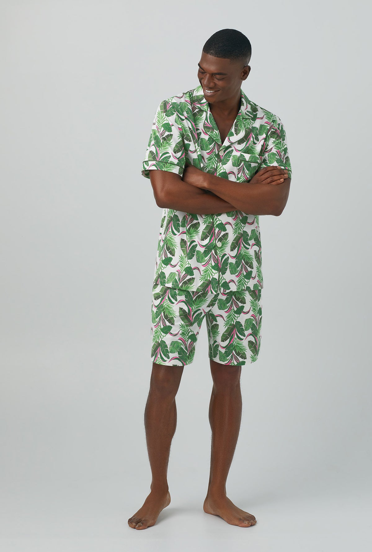 A man wearing green Short Sleeve Notch Stretch Jersey Short PJ Set with Palm Valley print