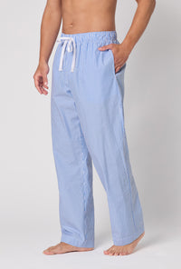 A Man Wearing French Stripe Men's Woven Supersoft Cotton Poplin Pj Pant in a side angled pose with one hand placed inside a pocket