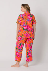A lady wearing plus size Orange Short Sleeve Classic Stretch Jersey Cropped Pj Set back view