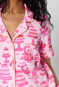 A Lady Wearing Cake Shop Short Sleeve Classic Shorty Stretch Jersey Pj Set posing with a detail view close up shot