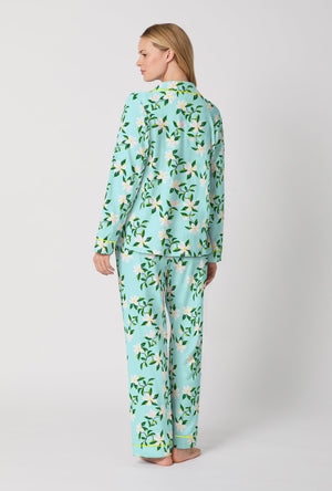 A Lady Wearing Blue Long Sleeve Classic Stretch Jersey PJ Set with Belle Blossoms Print Back View