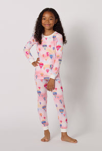 A Girl Wearing Serene Sunrise Long Sleeve Stretch Jersey Kids Pj Set