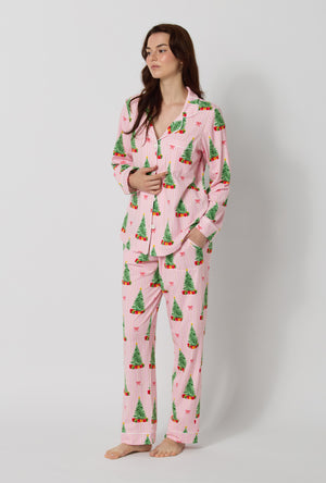 A lady wearing Pretty In Pine Long Sleeve Classic Stretch Jersey Pj Set looking side