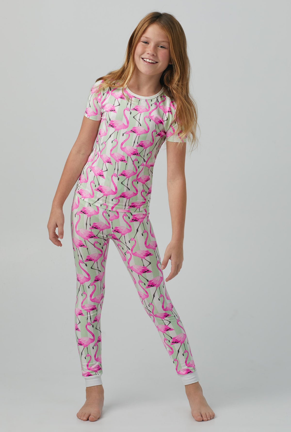 A girl wearing Short Sleeve Stretch Jersey Kids PJ Set with  Flamingo Bay print