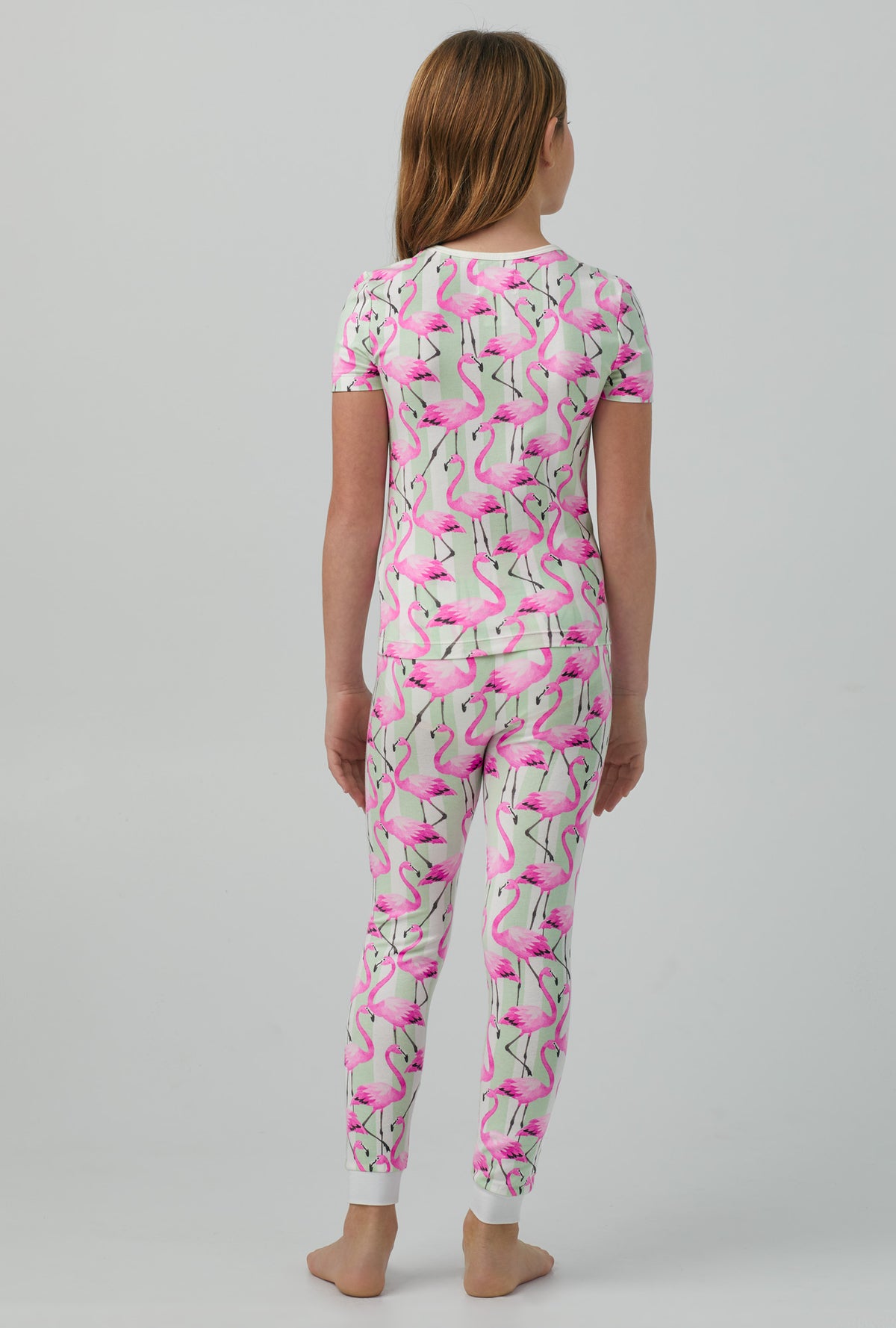 A girl wearing Short Sleeve Stretch Jersey Kids PJ Set with  Flamingo Bay print