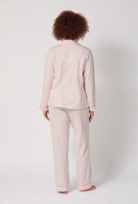 A lady wearing Blossom Geo Long Sleeve Classic Stretch Jersey Pj Set