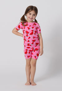 A little girl wearing Watermelon Crush Short Sleeve Stretch Jersey Kids Short Pj Set