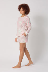 A lady wearing Blossom Geo Long Sleeve Pullover Crew And Shorty Stretch Jersey Pj Set