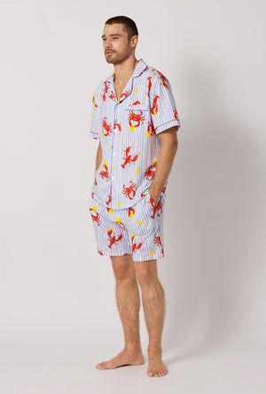 A man wearing Coastal Feast Men's Short Sleeve Classic Stretch Jersey Short Pj Set looking side