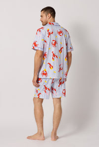 A man wearing Coastal Feast Men's Short Sleeve Classic Stretch Jersey Short Pj Set back view