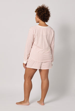 A lady wearing plus Blossom Geo Long Sleeve Pullover Crew And Shorty Stretch Jersey Pj Set