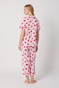 A Lady Wearing Berry Souffle Short Sleeve Classic Stretch Jersey Cropped PJ Set Back View
