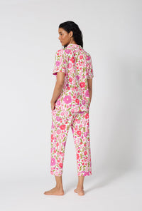 A Lady Wearing Josephine Short Sleeve Classic Stretch Jersey Cropped Pj Set in a back view pose