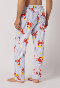 A man wearing Coastal Feast Men's Stretch Jersey Pj Pant back view