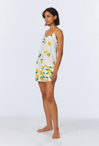 A lady wearing White and Yellow Cami Stretch Jersey Shorty PJ Set back view