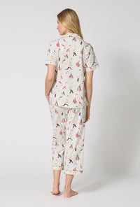 A Lady Wearing Bar A Vin Short Sleeve Classic Stretch Jersey Cropped Pj Set facing back while looking to the side