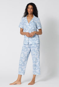 A Lady Wearing Minuet Toile Short Sleeve Classic Stretch Jersey Cropped Pj Set facing front in a side angled pose