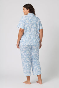 A Lady Wearing Plus Size Minuet Toile Short Sleeve Classic Stretch Jersey Cropped Pj Set in a back view pose