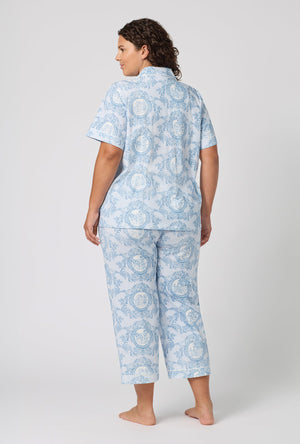 A Lady Wearing Plus Size Minuet Toile Short Sleeve Classic Stretch Jersey Cropped Pj Set in a back view pose