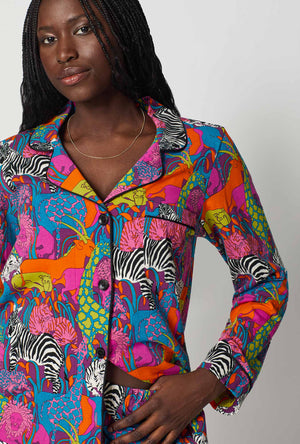 A lady wearing BedHead x Trina Turk Jungle Long Sleeve Classic Stretch Jersey Pj Set