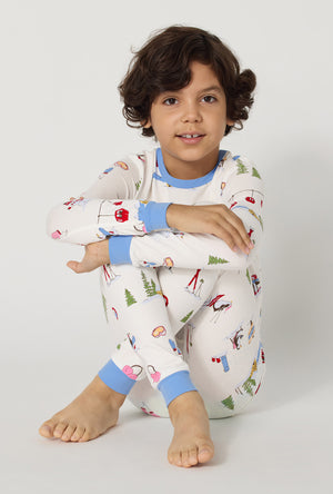 A boy Snow Much Fun Long Sleeve Stretch Jersey Kids Pj Set sitting down