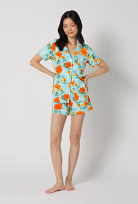A lady wearing Golden Breeze Short Sleeve Classic Shorty Stretch Jersey Pj Set looking down