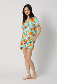 A lady wearing Golden Breeze Short Sleeve Classic Shorty Stretch Jersey Pj Set