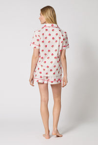 A Lady Wearing Celeste Short Sleeve Classic Woven Supersoft Cotton Poplin Shorty Pj Set turned back pose while looking to the side