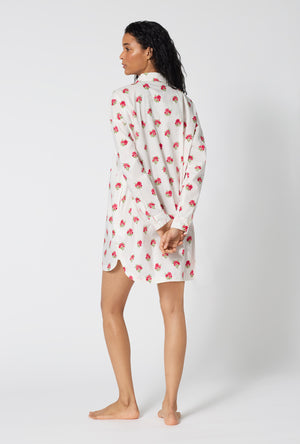 A Lady Wearing Celeste High Low Woven Supersoft Cotton Poplin Boyfriend Shirt showing a back view pose while looking to the side