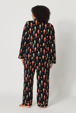 A lady wearing plus size Twinkle & Drum Long Sleeve Classic Stretch Jersey Pj Set back view
