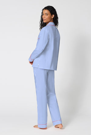 A Lady Wearing French Stripe Long Sleeve Classic Woven Supersoft Cotton Poplin Pj Set in a back view pose while looking back over the shoulder