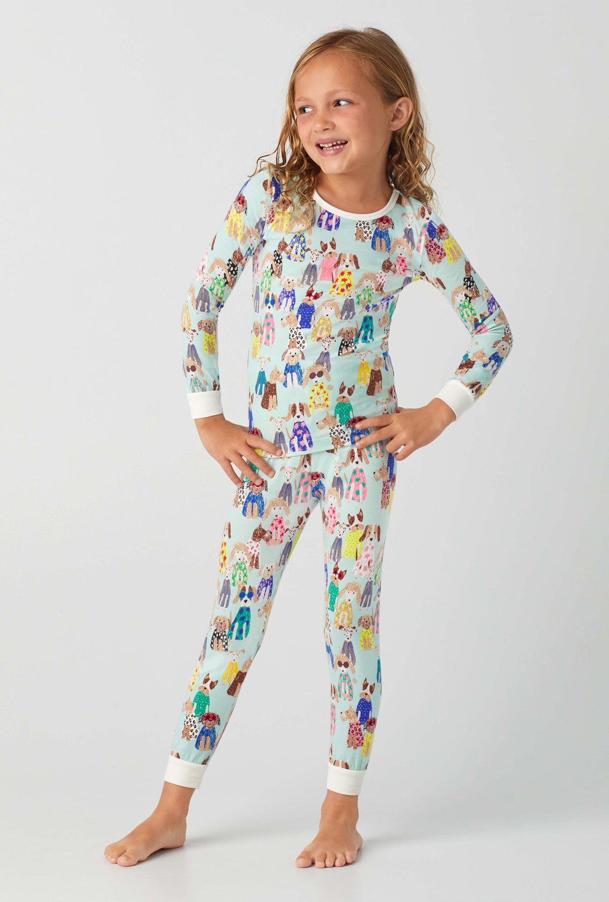A girl wearing Fashion Hounds Long Sleeve Stretch Jersey Kids PJ Set