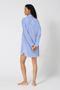 A Lady Wearing French Stripe High Low Woven Supersoft Cotton Poplin Boyfriend Shirt in a full back view pose