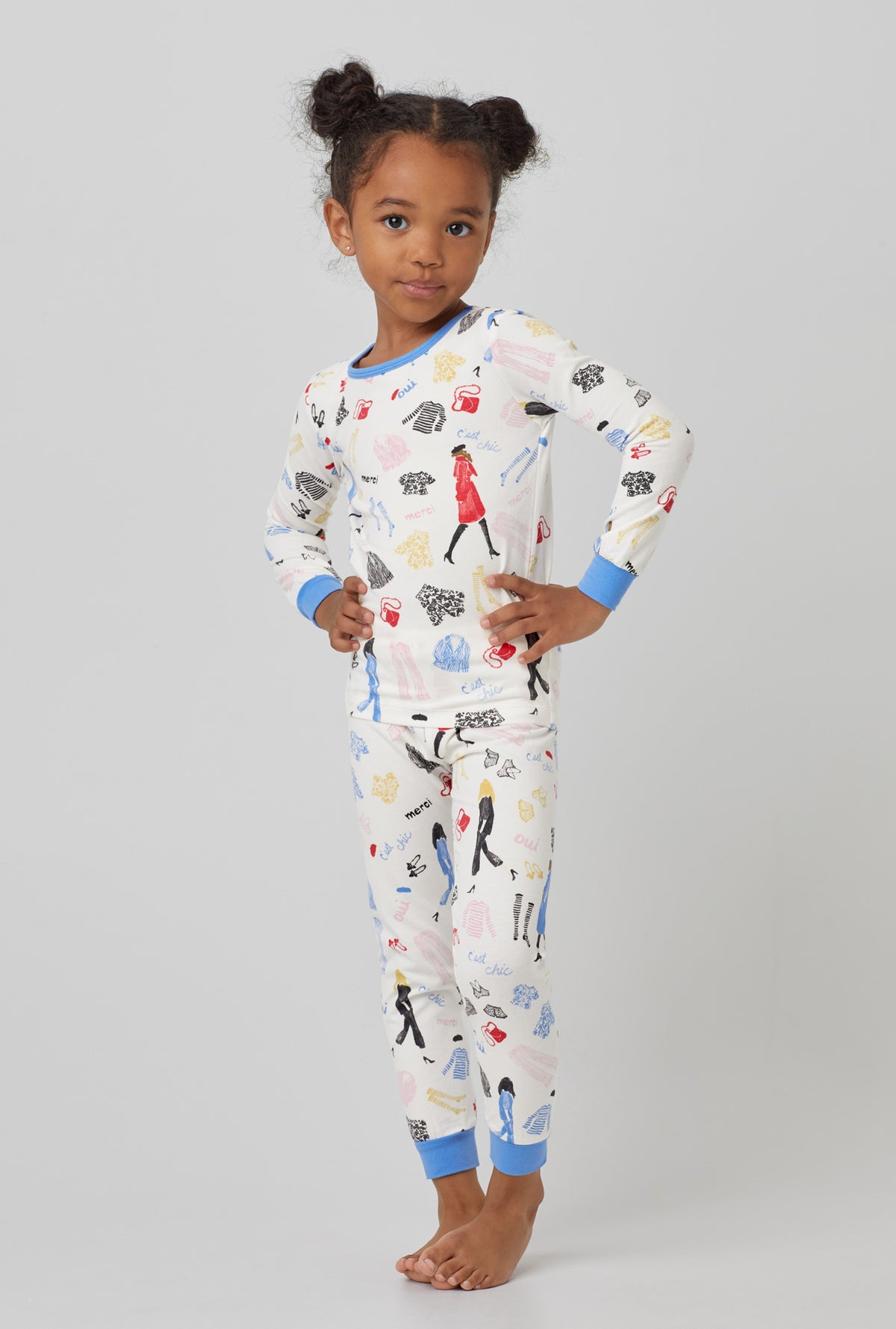 A  girl wearing  white Long Sleeve Stretch Jersey Kids PJ Set with Cest Chic  print