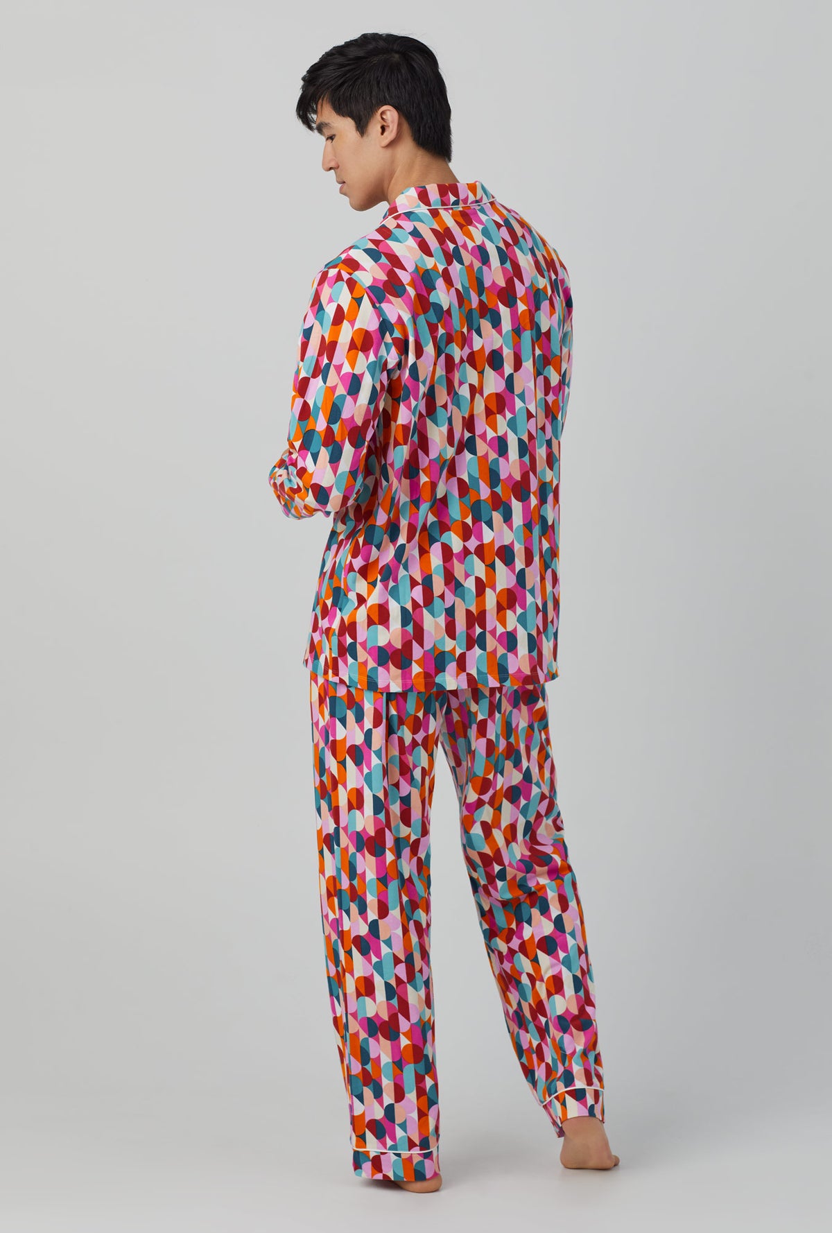 A man wearing Long Sleeve Classic Stretch Jersey PJ Set with dancing dots print