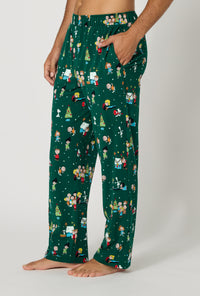 A man wearing Good Grief, It's Christmas! Men's Stretch Jersey Pj Pant side view
