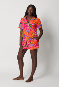 A lady wearing Orange Short Sleeve Classic Shorty Stretch Jersey Pj Set side view
