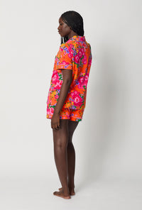 A lady wearing Orange Short Sleeve Classic Shorty Stretch Jersey Pj Set back view