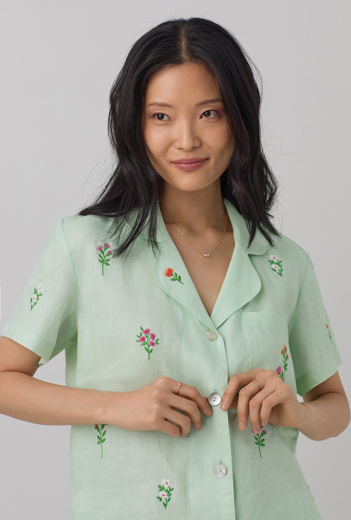 A lady wearing green  Short Sleeve Classic Shorty Woven Linen PJ Set with mint  print.