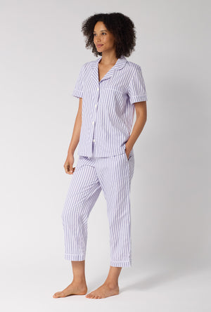 A Lady Wearing Blue Signature Stripe Short Sleeve Classic Woven Cotton Sateen Cropped Pj Set in a side angled pose