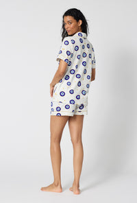 A Lady Wearing Eyeconic Short Sleeve Classic Shorty Stretch Jersey Pj Set in a back view pose