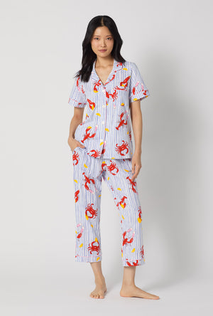 A lady wearing Coastal Feast Short Sleeve Classic Stretch Jersey Cropped Pj Set