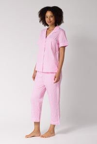 A Lady Wearing Pink Signature Stripe Short Sleeve Classic Woven Cotton Sateen Cropped Pj Set in a side angled pose