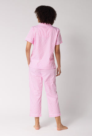 A Lady Wearing Pink Signature Stripe Short Sleeve Classic Woven Cotton Sateen Cropped Pj Set in a standing back view pose